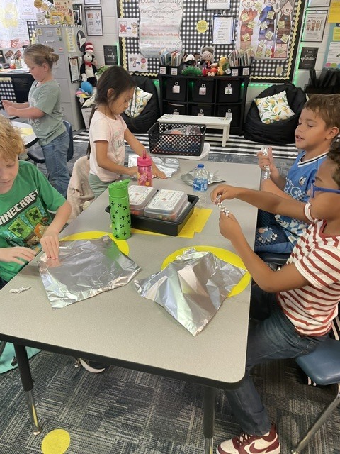 students learning and playing