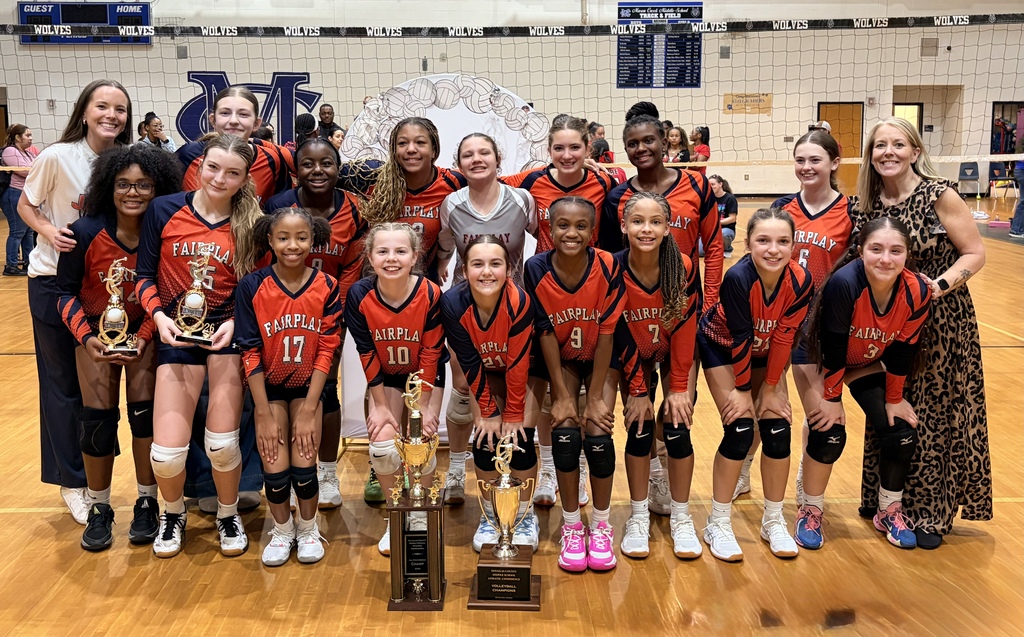 Fairplay Middle School volleyball team pictured with championship trophies.