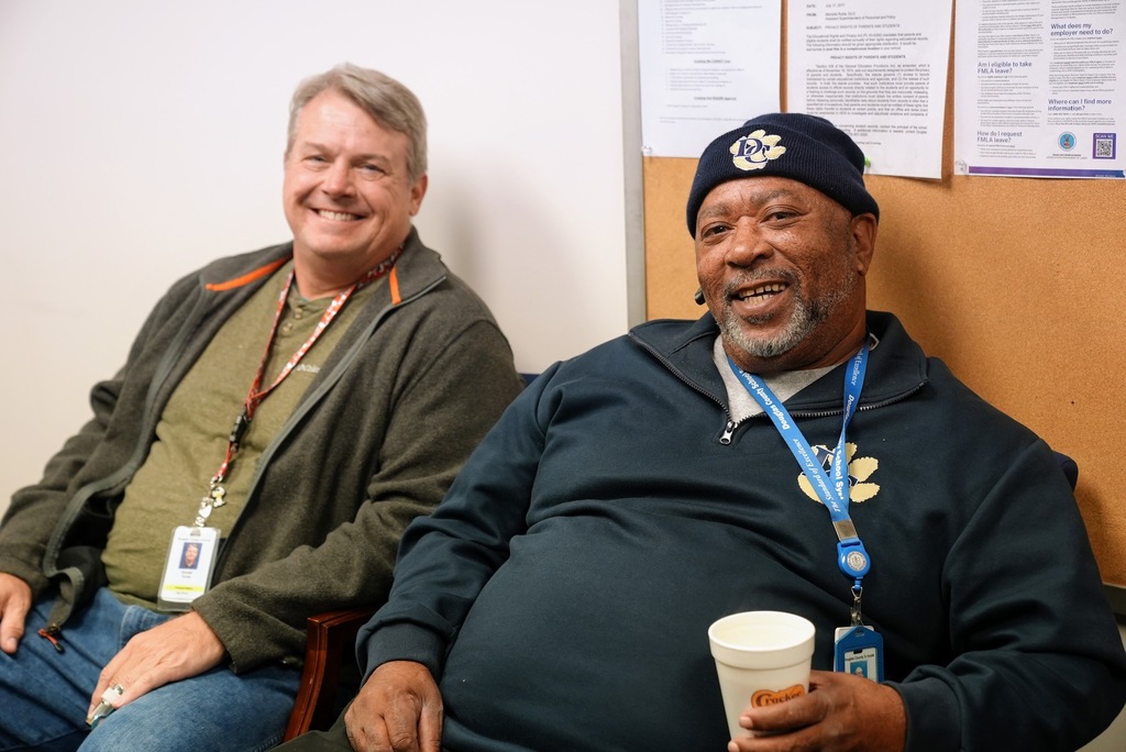 Two bus drivers smile at the DCSS appreciation breakfast.
