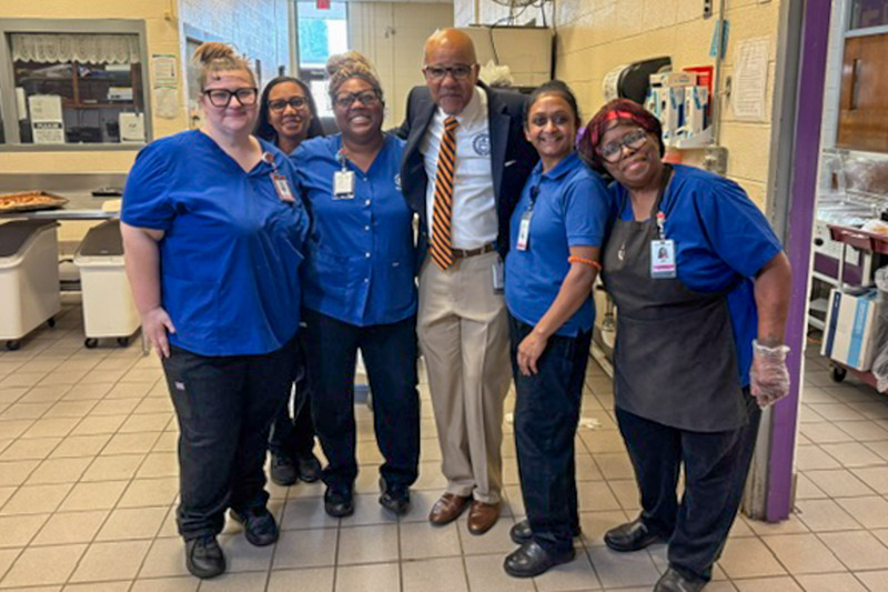 Superintendent Dr. North with a group of cafeteria workers on the first day of school.
