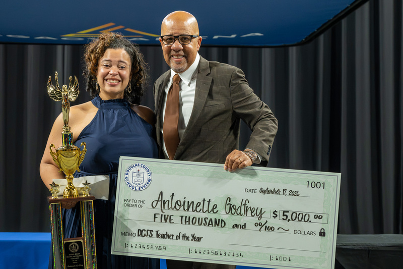2026-2027 TOTY Antoinette Godfrey with Superintendent Dr. Trent North.