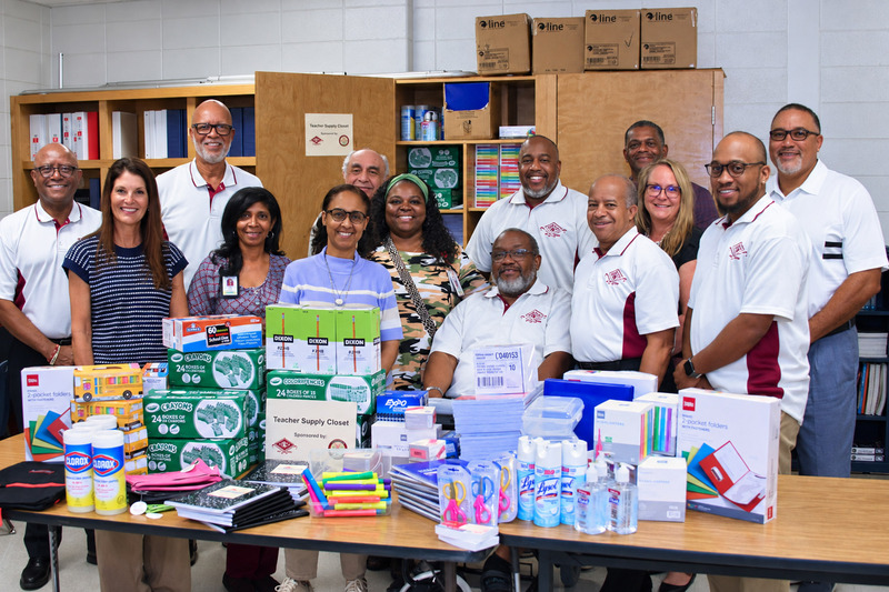 Supply Closet Donation group photo at AWES.