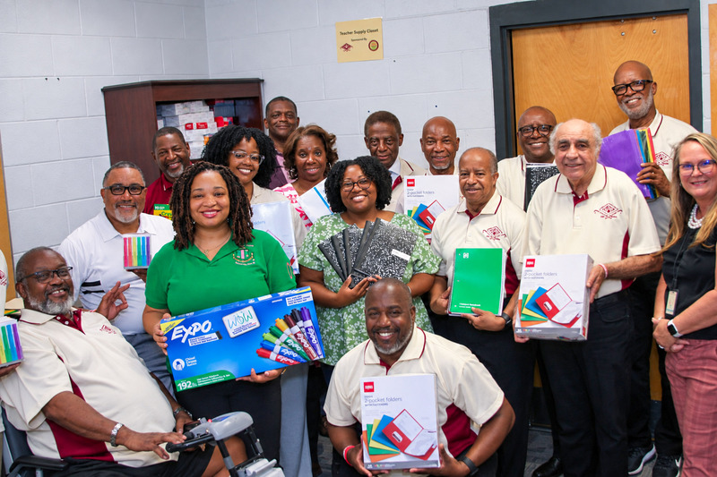 Supply Closet Donation group photo at SMS.