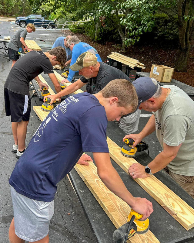 Students work on building a bed.