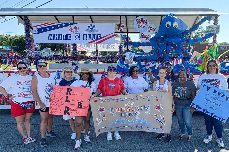 Media Specialists handed out books at the Fourth of July Parade.