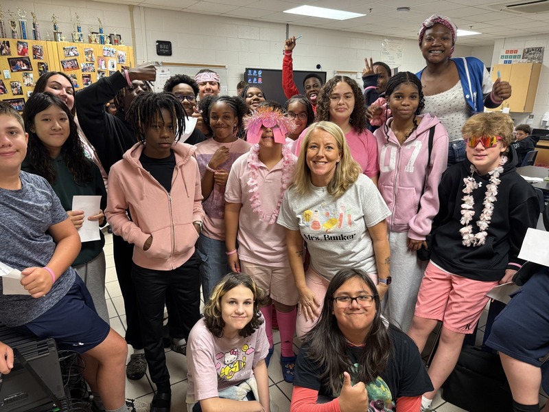 FMS teacher Kelly Bunker and her students dressed in pink for the House Meeting.