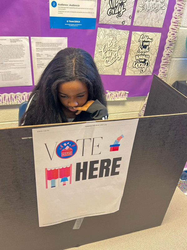 A student votes in the MCMS Student Council election