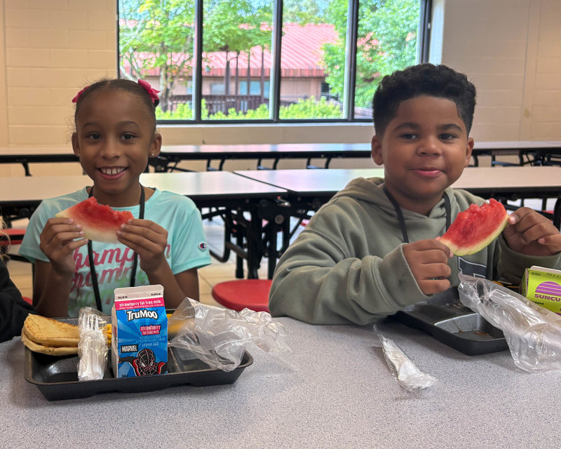 Students eat watermelon