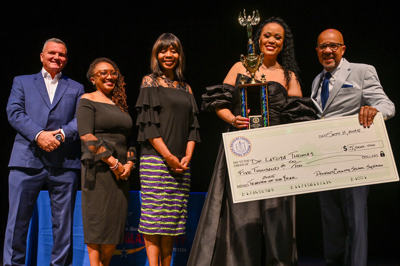 Dr. North presents TOTY Dr. Thomas with a check.