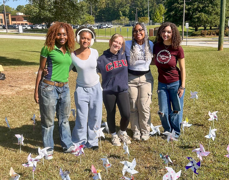 CHHS students  with their pinwheels for peace.