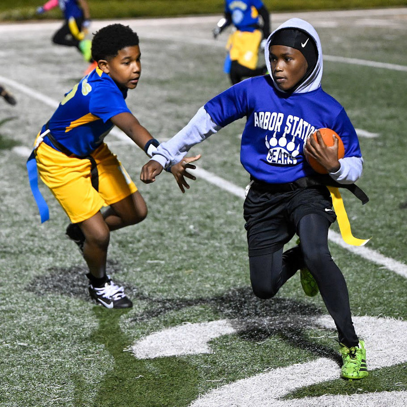 An ASES player tries to avoid getting his flag pulled by a NMES player in pusuit.