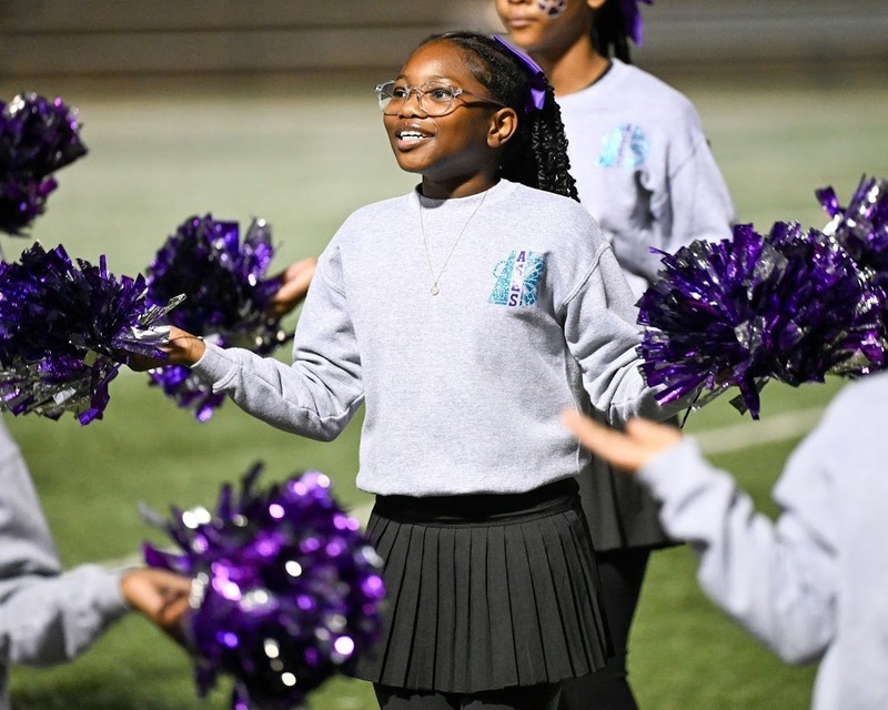 An ASES cheerleader cheers during the Turkey Bowl.