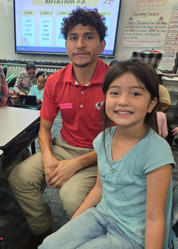 A student and her father at MAES on National Parent Involvement Day