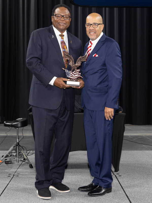 Frank Clay receiving his award from Superintendent Dr. North.