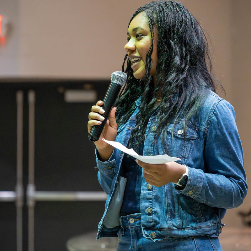 IB senior Anointed Enahoro speaks to her classmates about attending the IB Global Conference in The Hague.