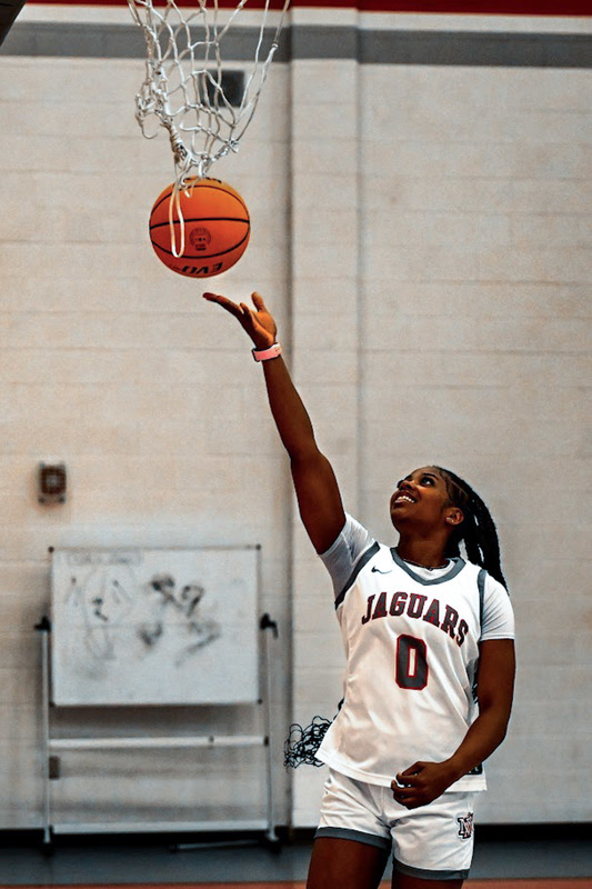 New Manchester senior guard Andrea Guilford shoots a layup.