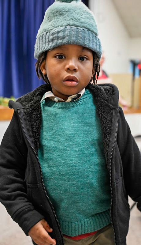 A little boy at LEAP Christmas Party.