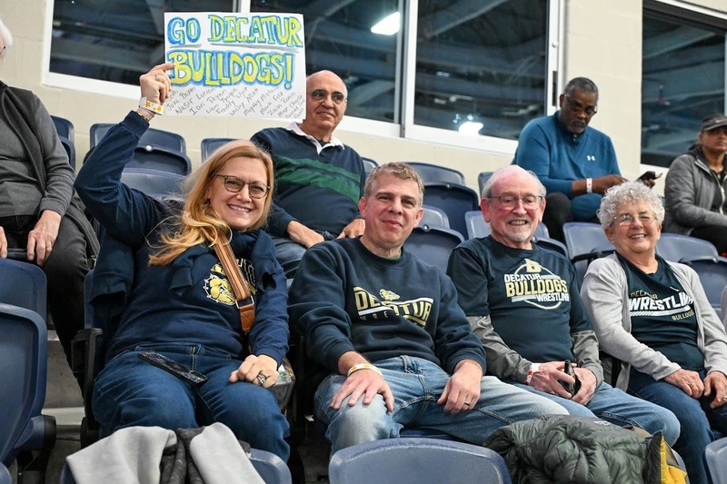 Fans from Decatur wave a sign from the stands at Legacy Arena.