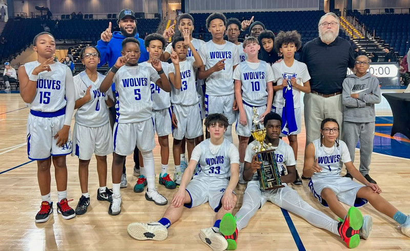 Mason Creek's seventh grade boys basketball team with the championship trophy.