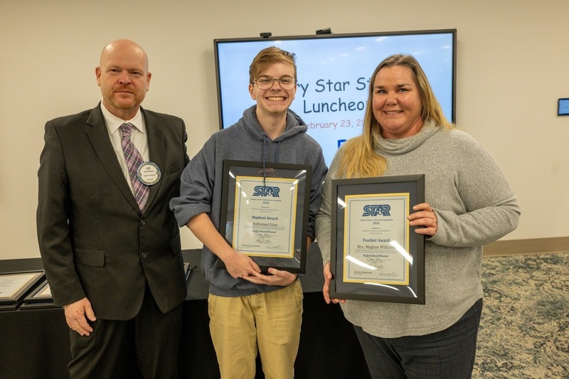 Rotary President Joe Williams, Harvester Christian Academy STAR Student Nathanael Ginn and STAR Teacher Meghan Williams.