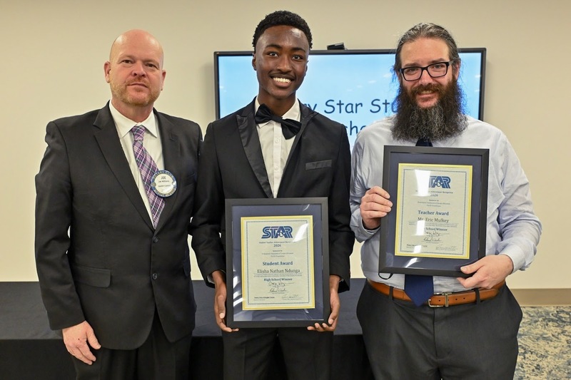 Rotary President Joe Williams, NMHS STAR Student Elisha Ndunga and STAR Teacher Andrew Mulkey.