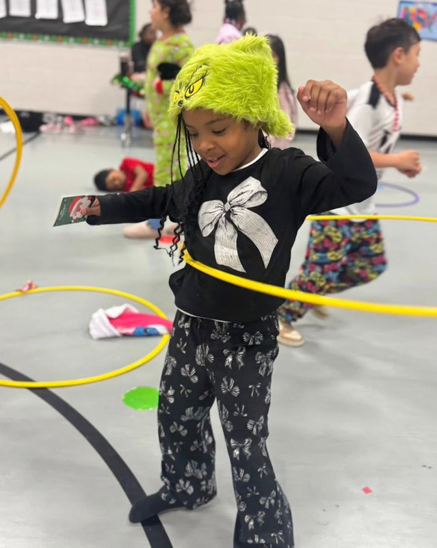 A Sweetwater Elementary does a hoola hoop during a Gym Jam.