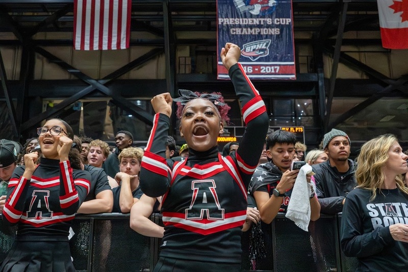 Alexander cheerleaders and fans cheer on the team during the state title game.