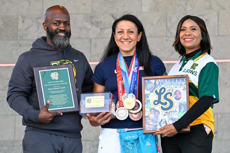 Lithia Springs High Principal Felicia Jones and Assistant Principal Mikey Jones present Elana Meyers Taylor with gifts at the homecoming celebration on March 21, 2026.