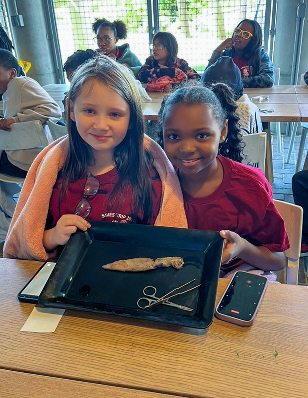 Two Sweewater students display a project at a museum on their Savannah trip.