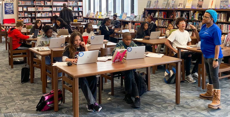 Stewart Middle students participate in the Compudopt seminar in the school media center.