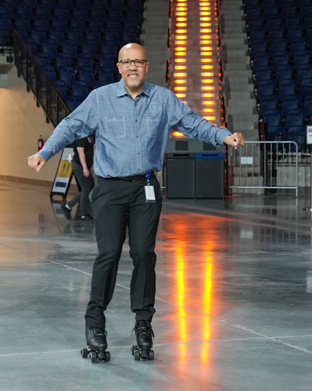 Superintendent Dr. Trent North roller skates during Roll Bounce at Legacy Arena.