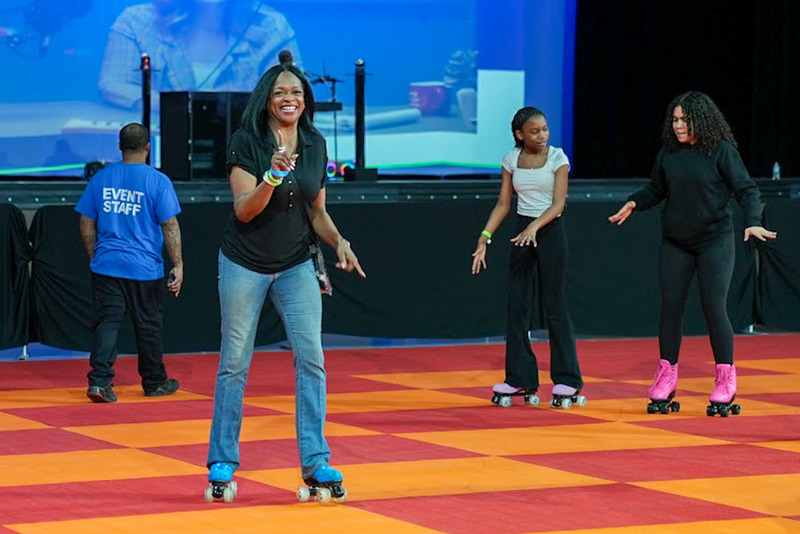 Arbor Station Principal Dr. Emily Felton skates during Roll Bounce.