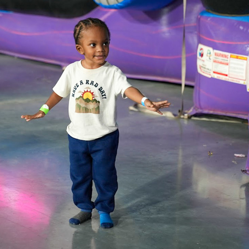 A little boy enjoys the play area at Roll Bounce.