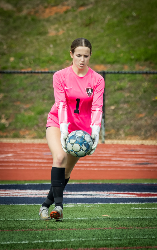 Alexander goalkeeper Reece Holmes kicks the ball out of the box during a game.
