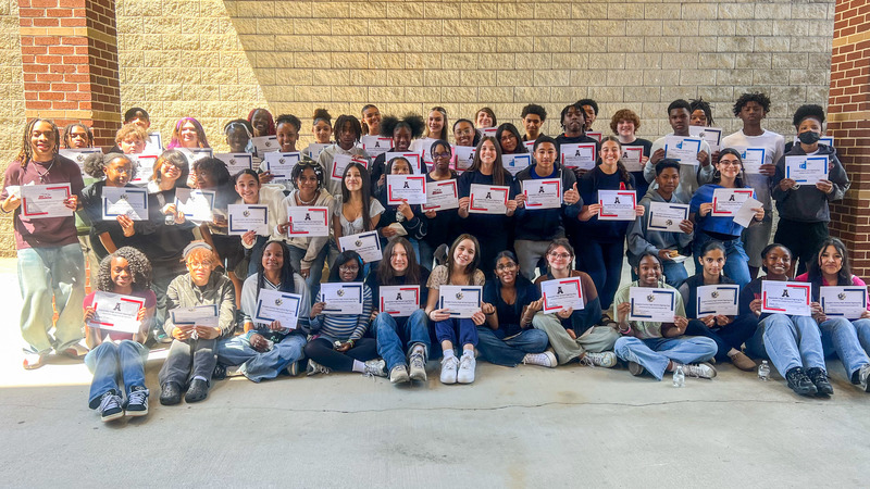 Group photo of Mason Creek Middle students with their magnet signing certificates.