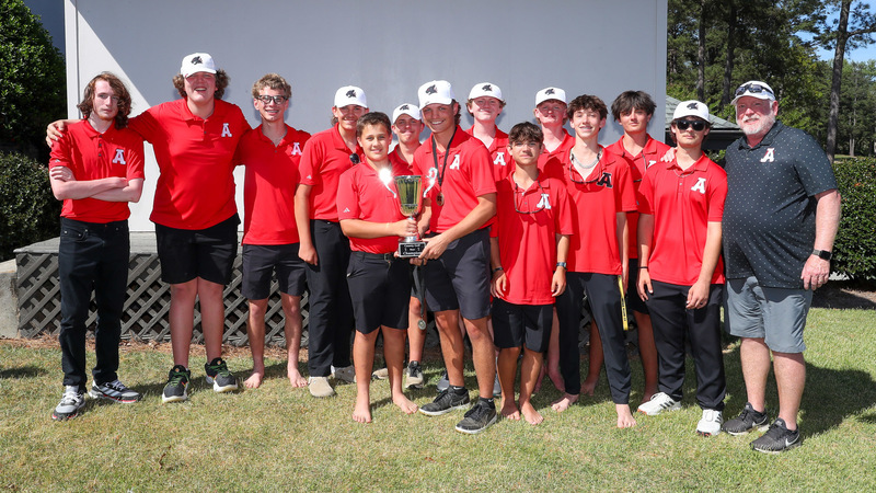 Alexander boys golf team members with their county championship trophy.