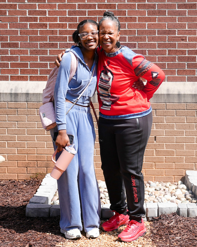 Former New Manchester High PTSA President Kemiko Lawrence and a student pose for a photo in the new Memorial and Wellness Garden.