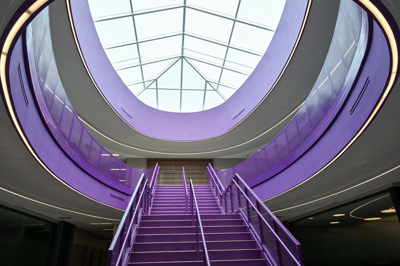 Photo of the atrium looking up the stairs in the new academic addition at CHHS.
