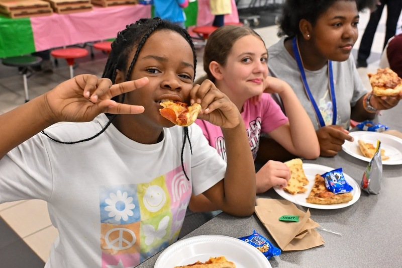 An Eastside student enjoys pizza at a special celebration.