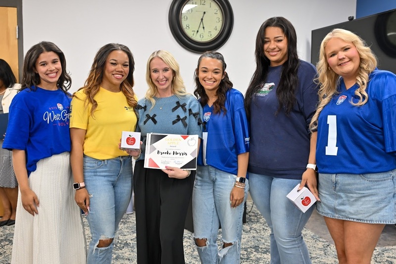 Alexander High teacher Brooke Morris with the five students who gave her the Golden Apple Award.