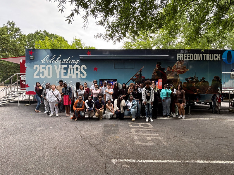 Douglas County High students take a group photo outside the Freedom Truck.