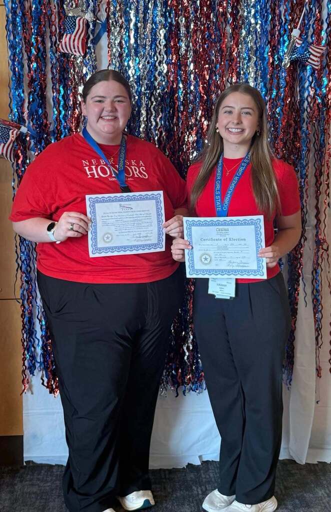 Noelle Beyl and Lillian Lakner holding their certificates at Nebraska Cornhusker Girls State.