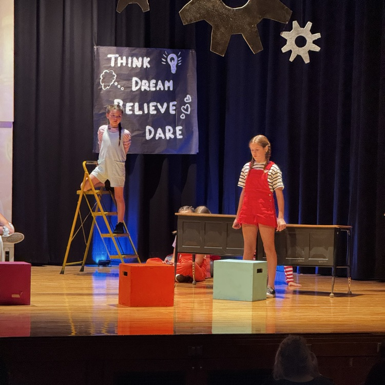 kids on stage for drama performance 