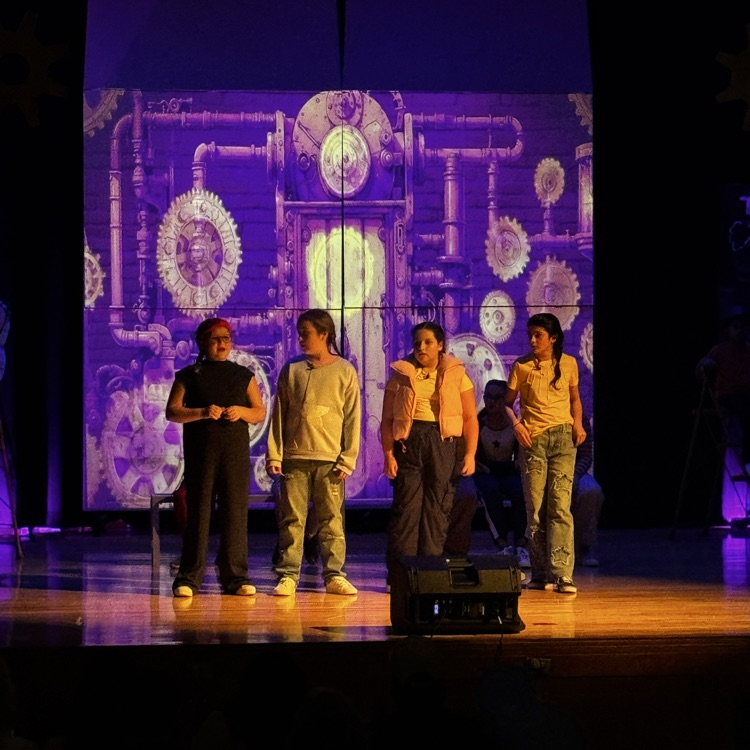 kids on stage for drama performance 