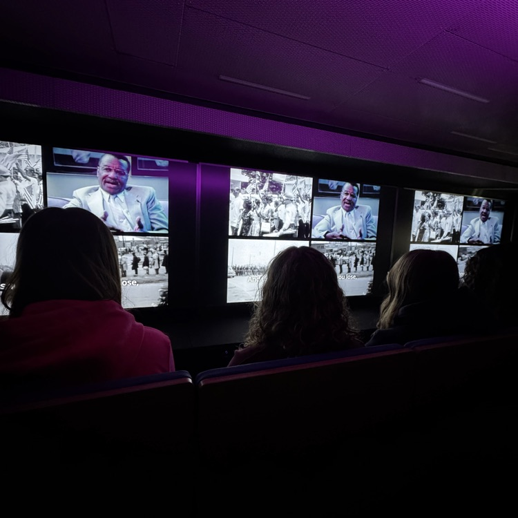 students sitting inside a mobile museum 