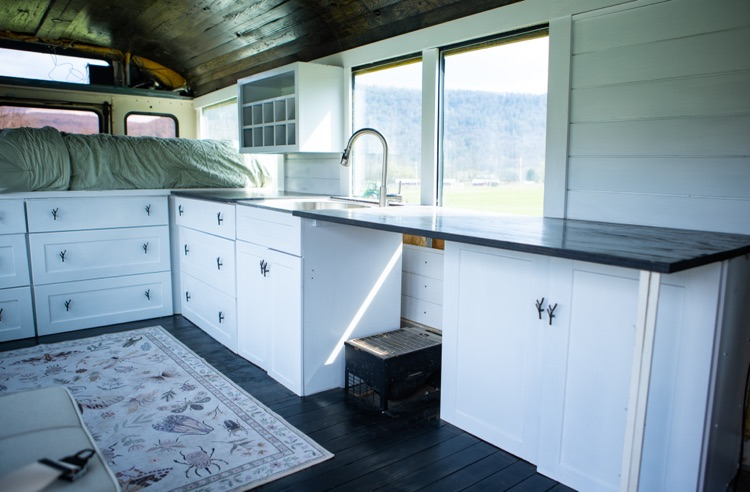 sink and kitchen inside view of bus