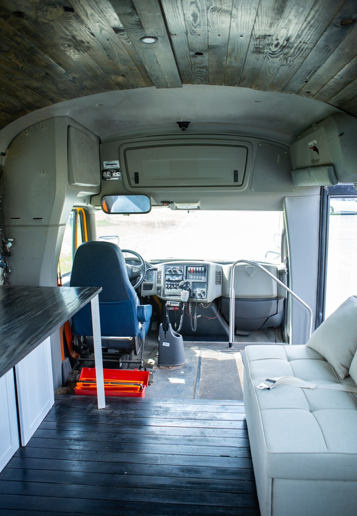 view to drivers seat and front window in bus