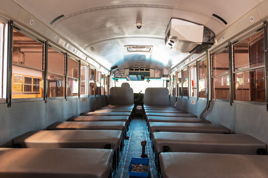 school bus with seat backs taken out