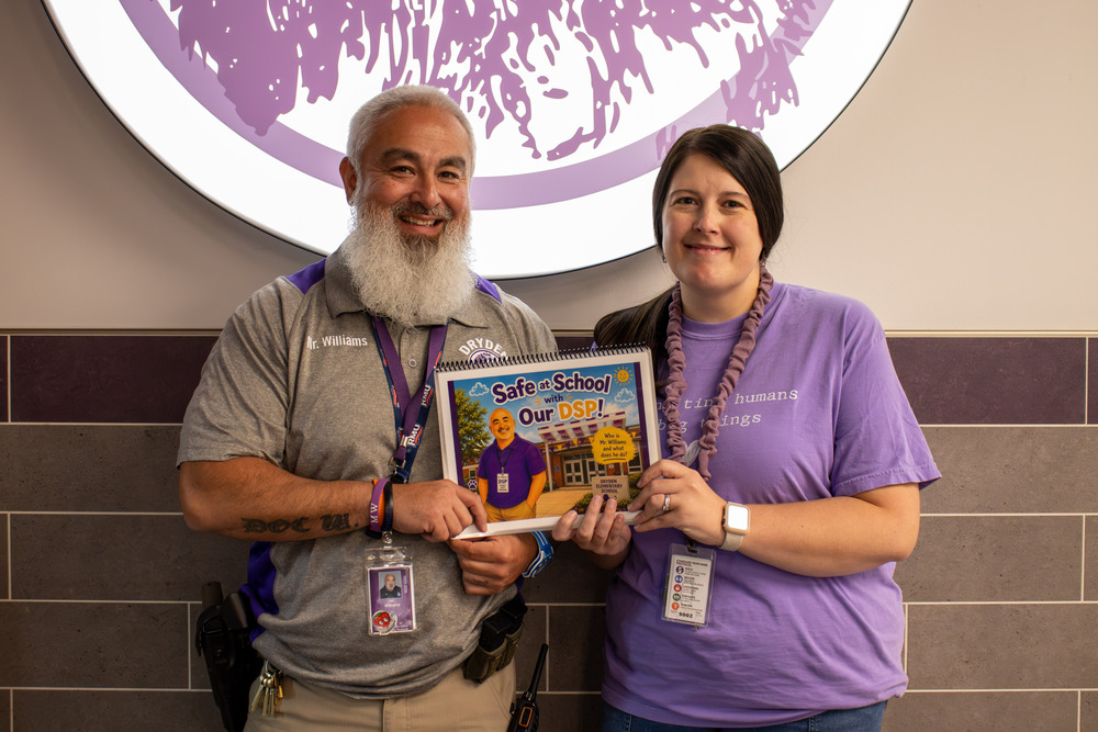Justin Williams and Lacey Brown with DSP book