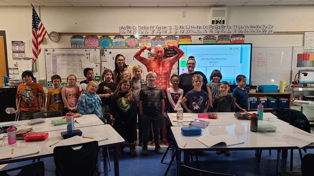 Muscle Woman Visits Third Grade! In Mrs. Preston and Mrs. Frailey’s third-grade class, students are learning all about the systems of the human body! To introduce the muscular system, Mrs. Preston transformed into her alter ego — Muscle Woman! Students made connections between the skeletal and muscular systems, discovering how their bodies move and grow. A big thank-you to our amazing teachers for making learning interactive, engaging, and meaningful for our students! 💜🦁 #LionPride #DrydenElementary #HandsOnLearning